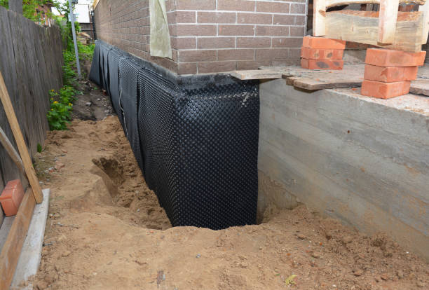 Happy homeowners after waterproofing job in South Solon